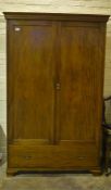 A 19th century mahogany 2 door wardrobe with single full length lower drawer