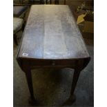 Late 18th century oak drop leaf table, standing on pad feet with a double drawer