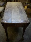Late 18th century oak drop leaf table, standing on pad feet with a double drawer