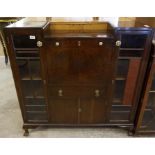mahogany stained fall front bureau with a glazed bookcase either side.