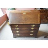 Georgian oak bureau 3ft. 3 " wide, fitted interior with 4 graduated drawers having brass pulls