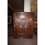 Late 19th Century hanging corner wall cabinet with carved front
