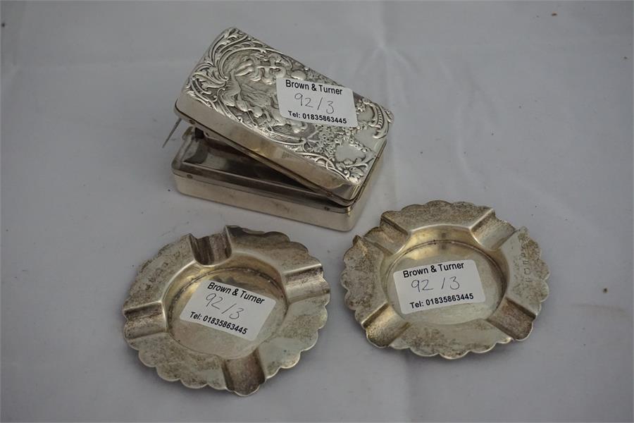 2 Silver ashtrays and 1 silver hair tong heater with relief decoration