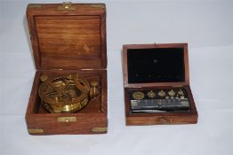 Replica boxed compass and a late 19th century boxed set of chemical weights for dyeing fabrics