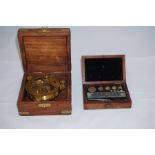 Replica boxed compass and a late 19th century boxed set of chemical weights for dyeing fabrics