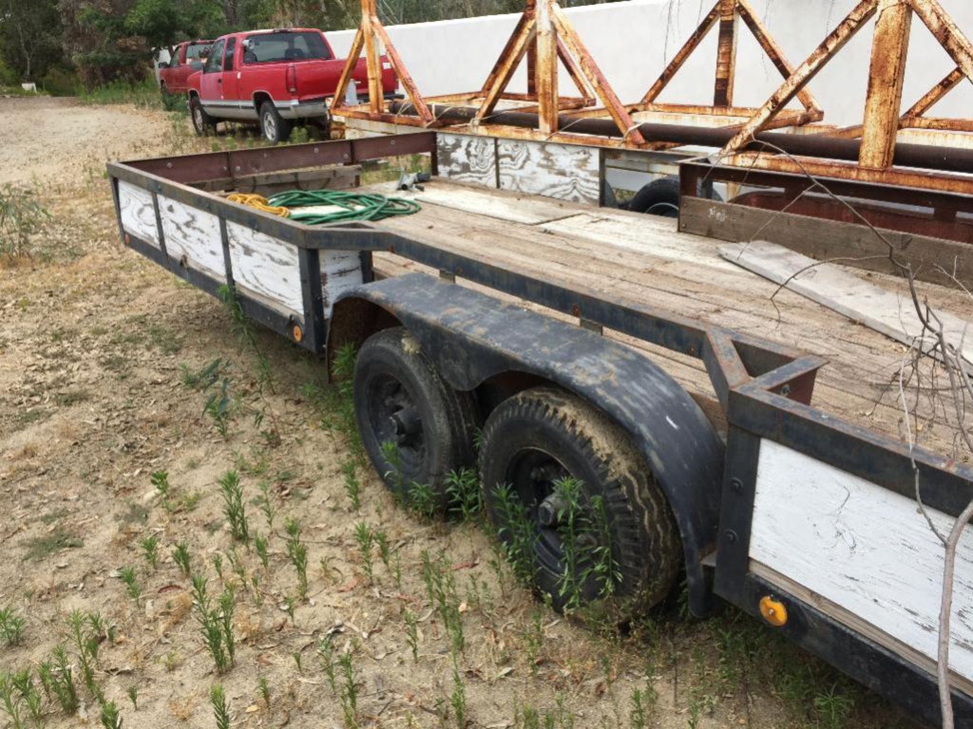 Trailer 2 axle 20ft. with tires and mud guard. Metal stake perimeter about 12" high. Wood plank plat - Image 2 of 2
