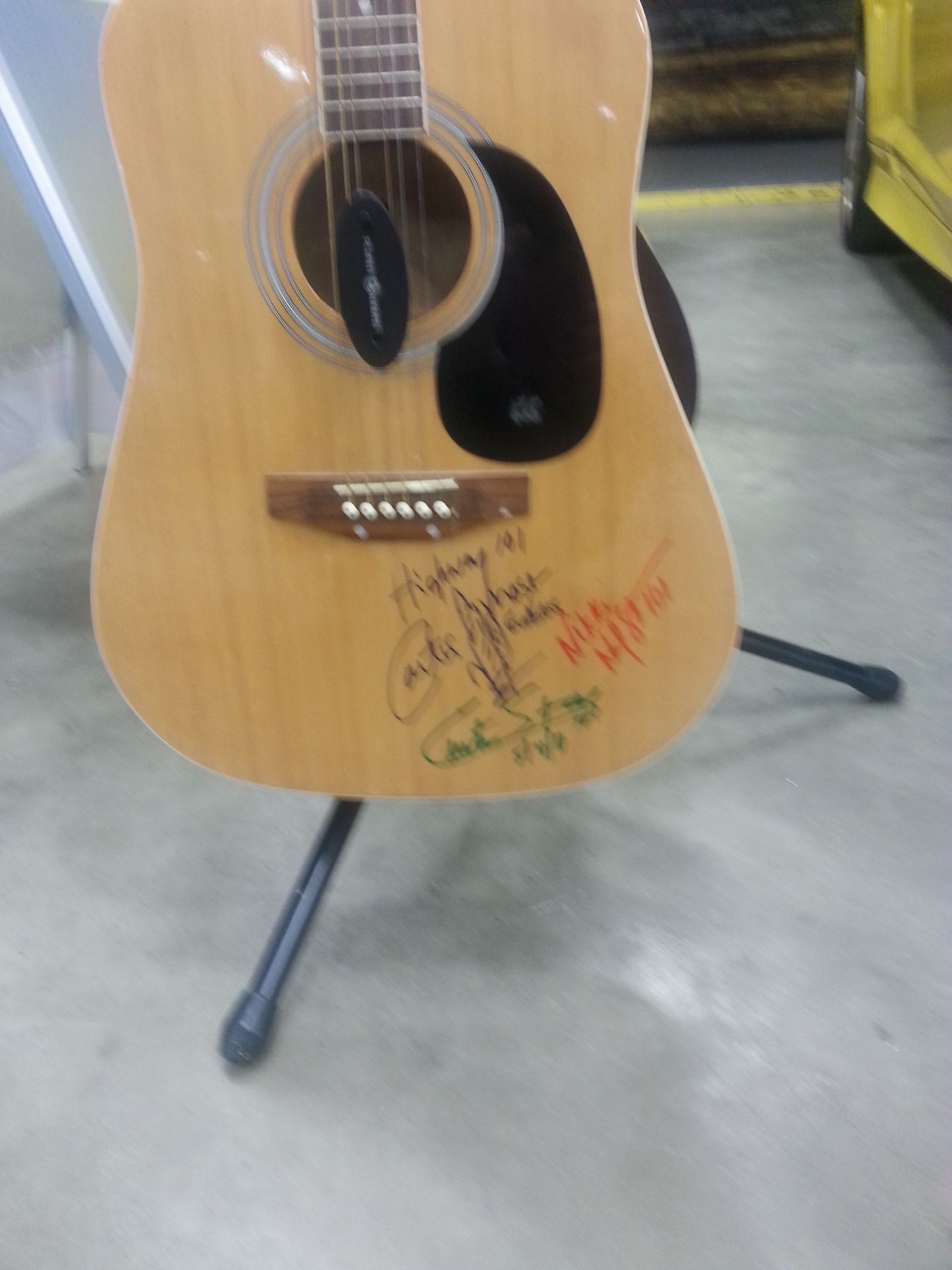 signed guitar and picture by Highway 101