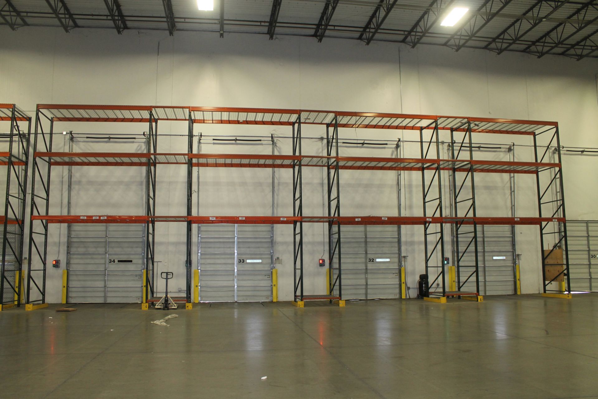 7 SECTION OF OVER-DOCK-DOOR PALLET RACKS,