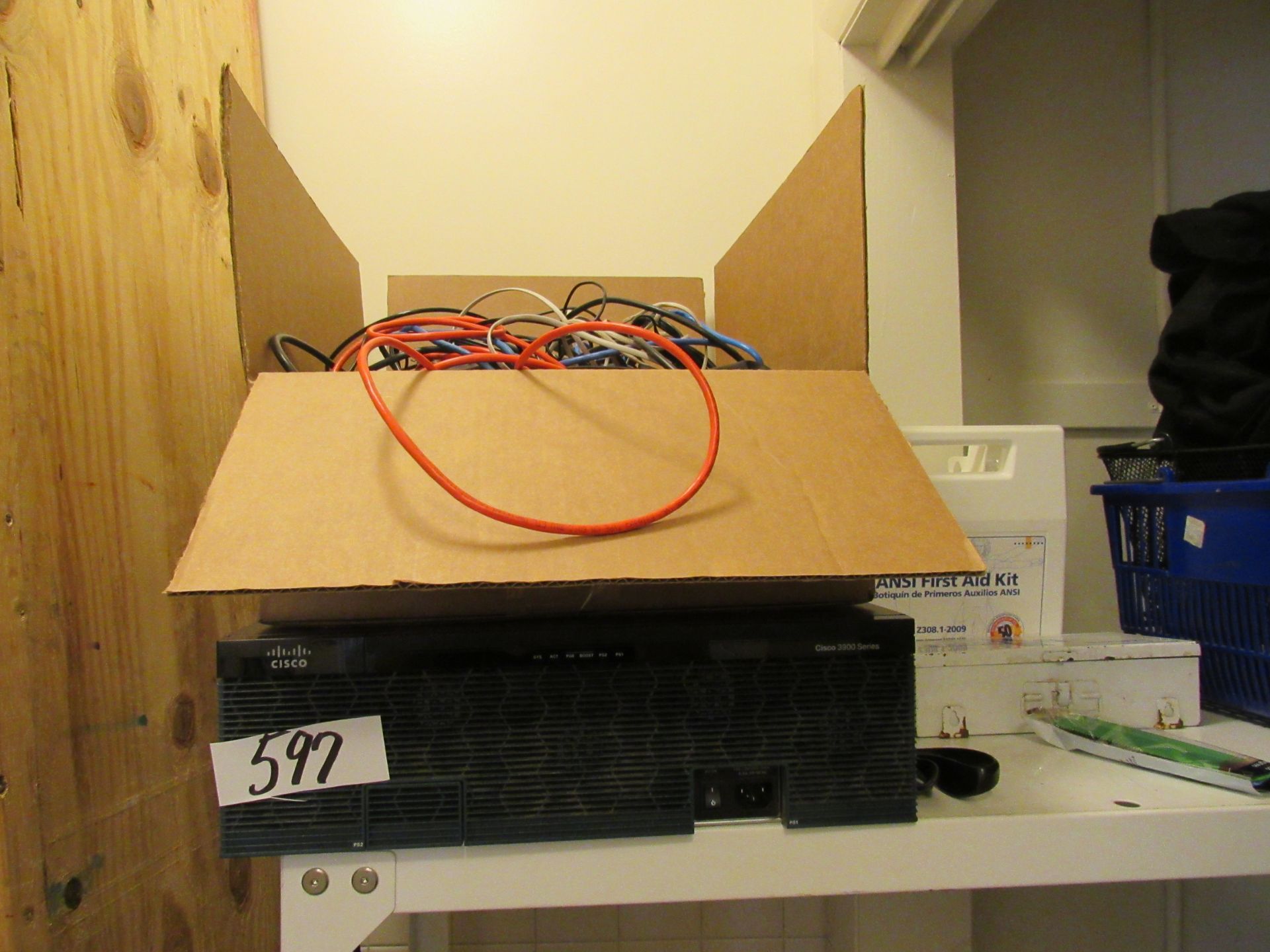 Cisco series 3300 and box of computer and electrical cords