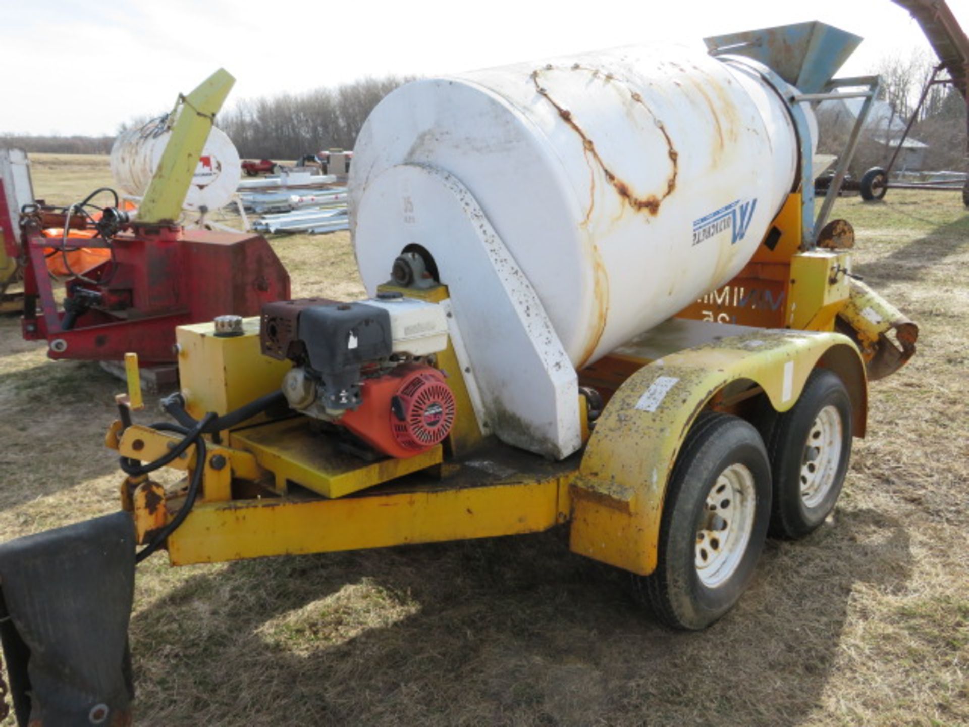 Concrete mini 125 one yard mixer mounted on tandem axle trailer