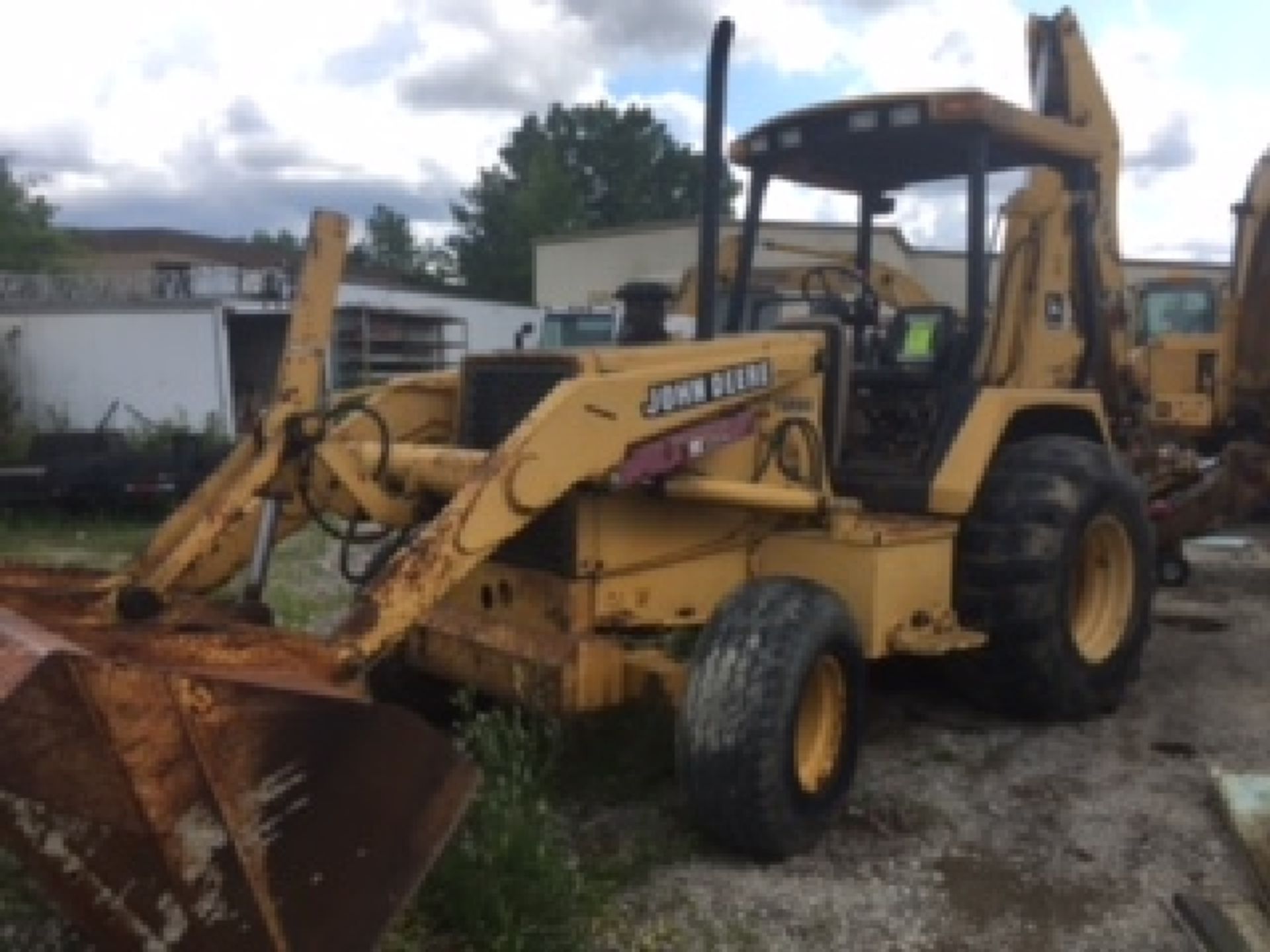 John Deere 510D backhoe. 4418 hours listed. Turbo diesel. Equipment ID# TO510DB815432