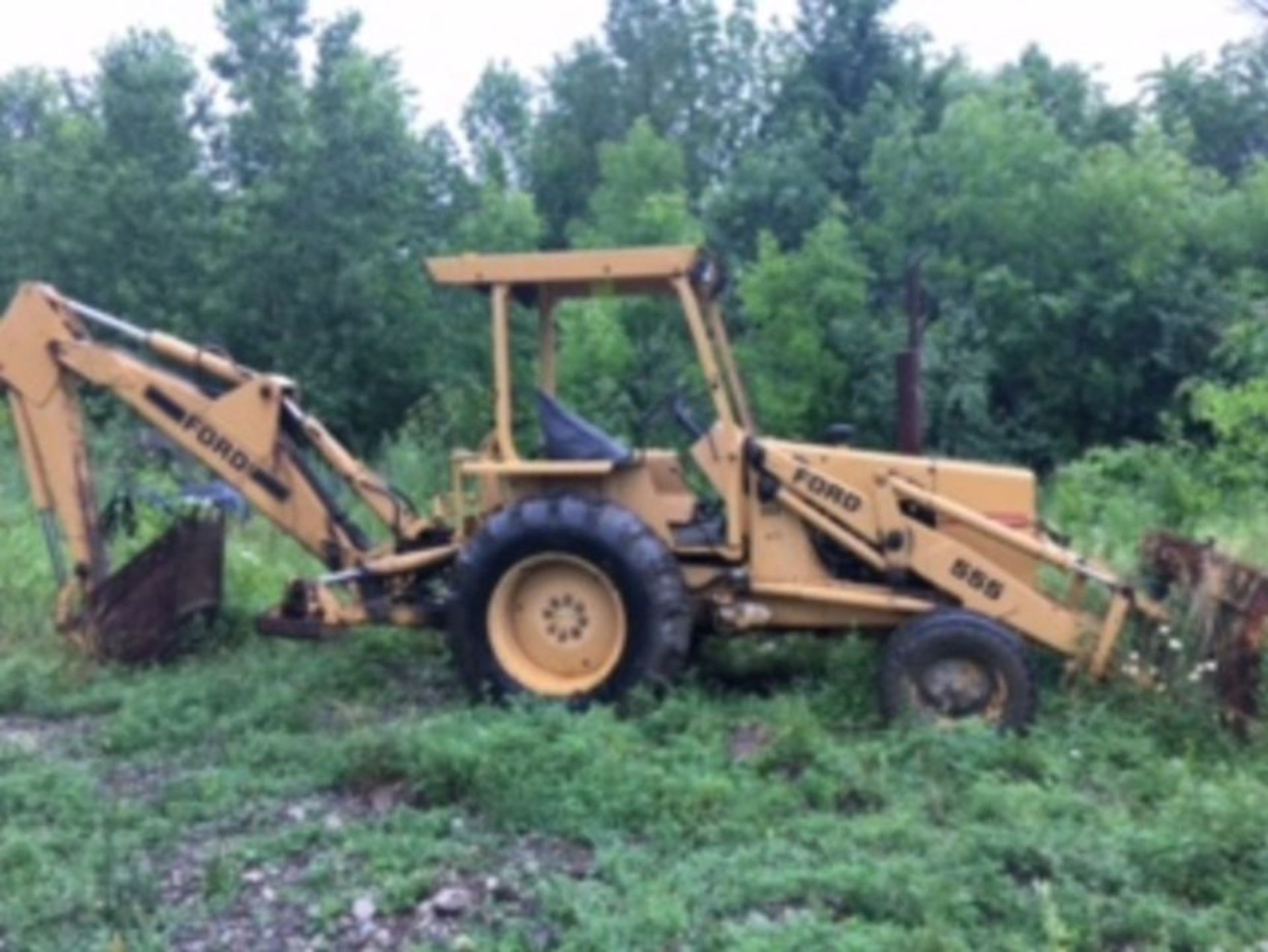 1983 Ford 555 loader/backhoe w/ new motor, runs good, 4956.7 hours listed.