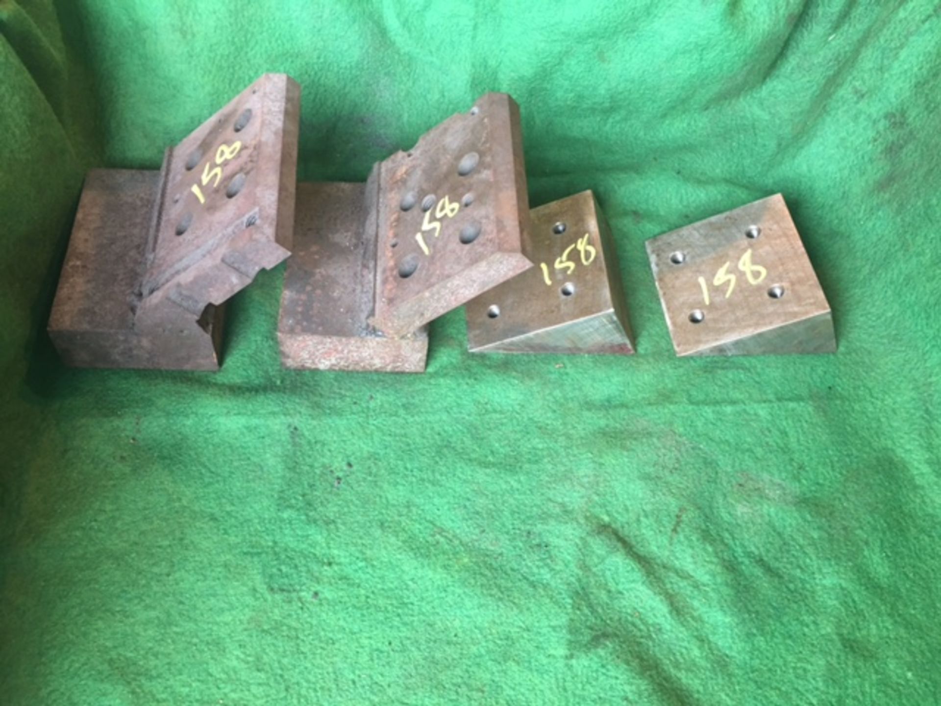 (2) 45 deg angle plates and (2) 30 deg wedge blocks.