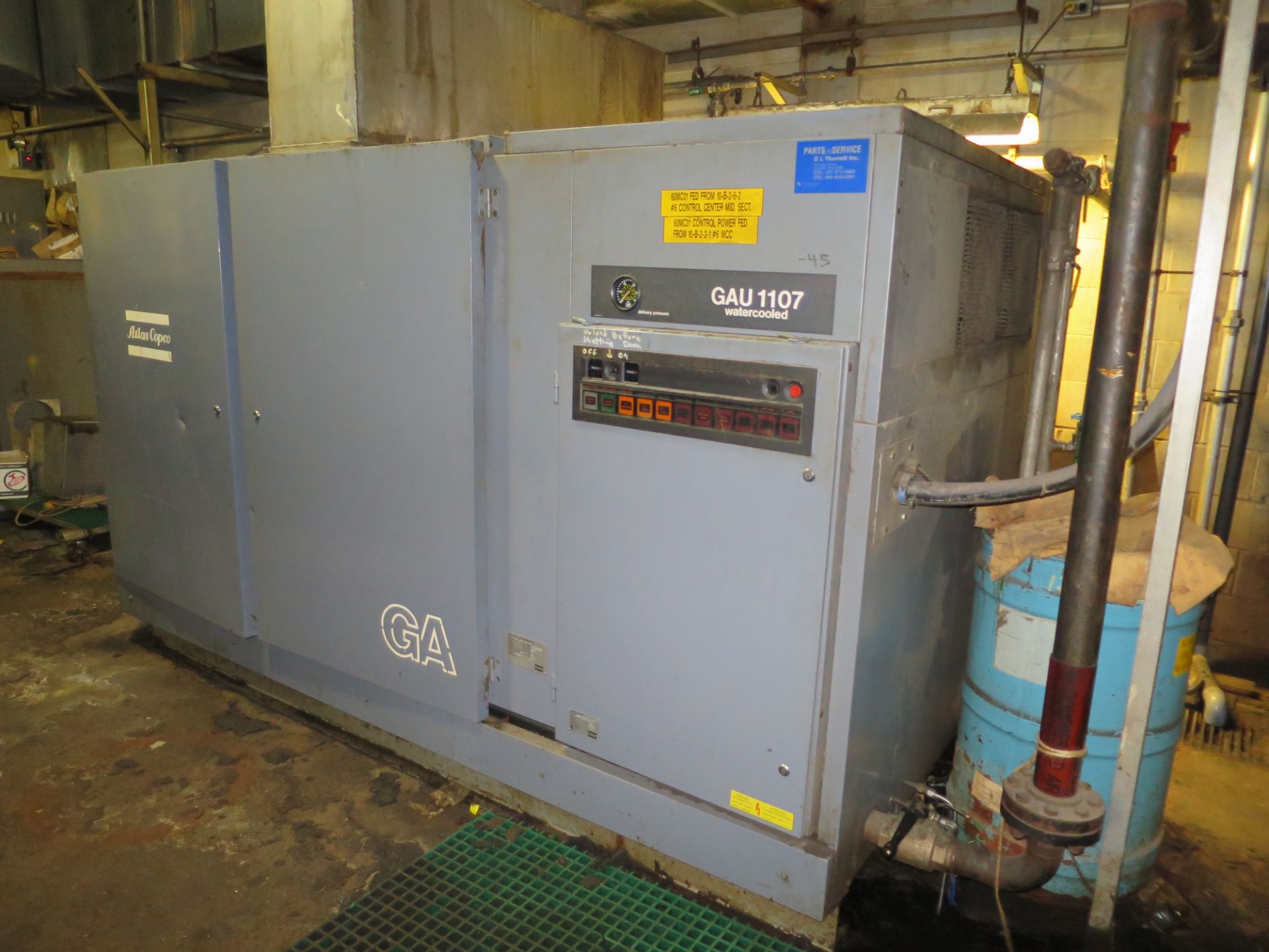 Atlas Copco air compressor, type GAU-1107, 575 volt, mfg 1998, with connecting Pall air dryer and