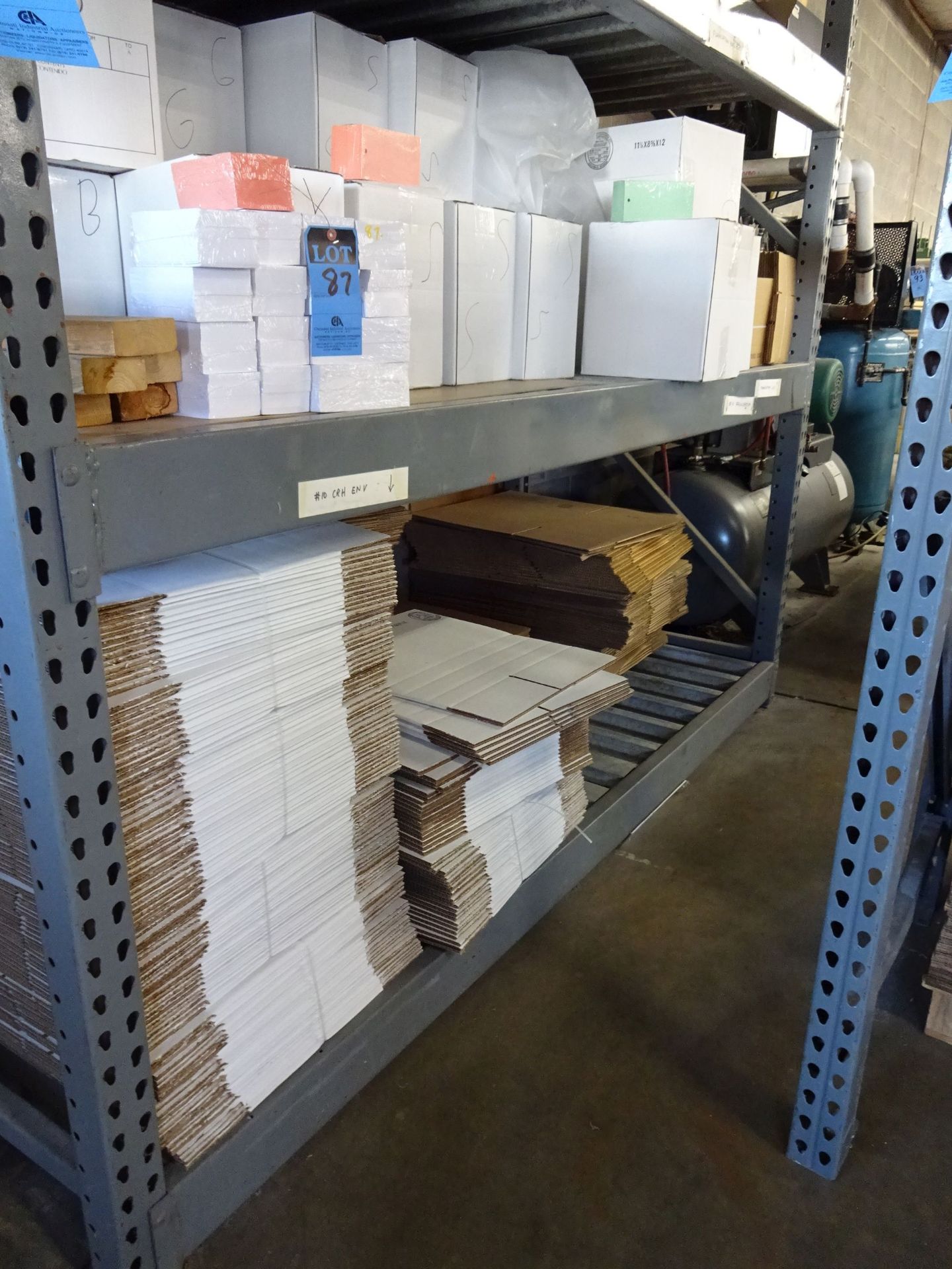 (LOT) CORROGATED AND CARD STOCK ON RACKS