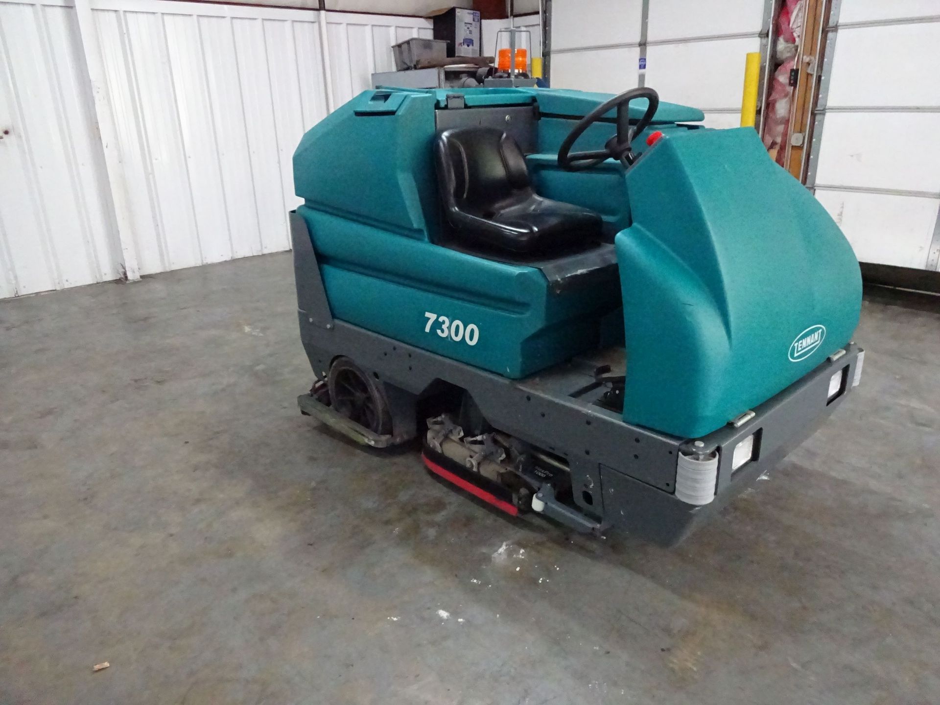 TENNANT MODEL 7300 ELECTRIC SIT DOWN FLOOR SCRUBBER; S/N 7300-5076 (695 HOURS), W/ 36-VOLT CHARGER - - Image 3 of 13