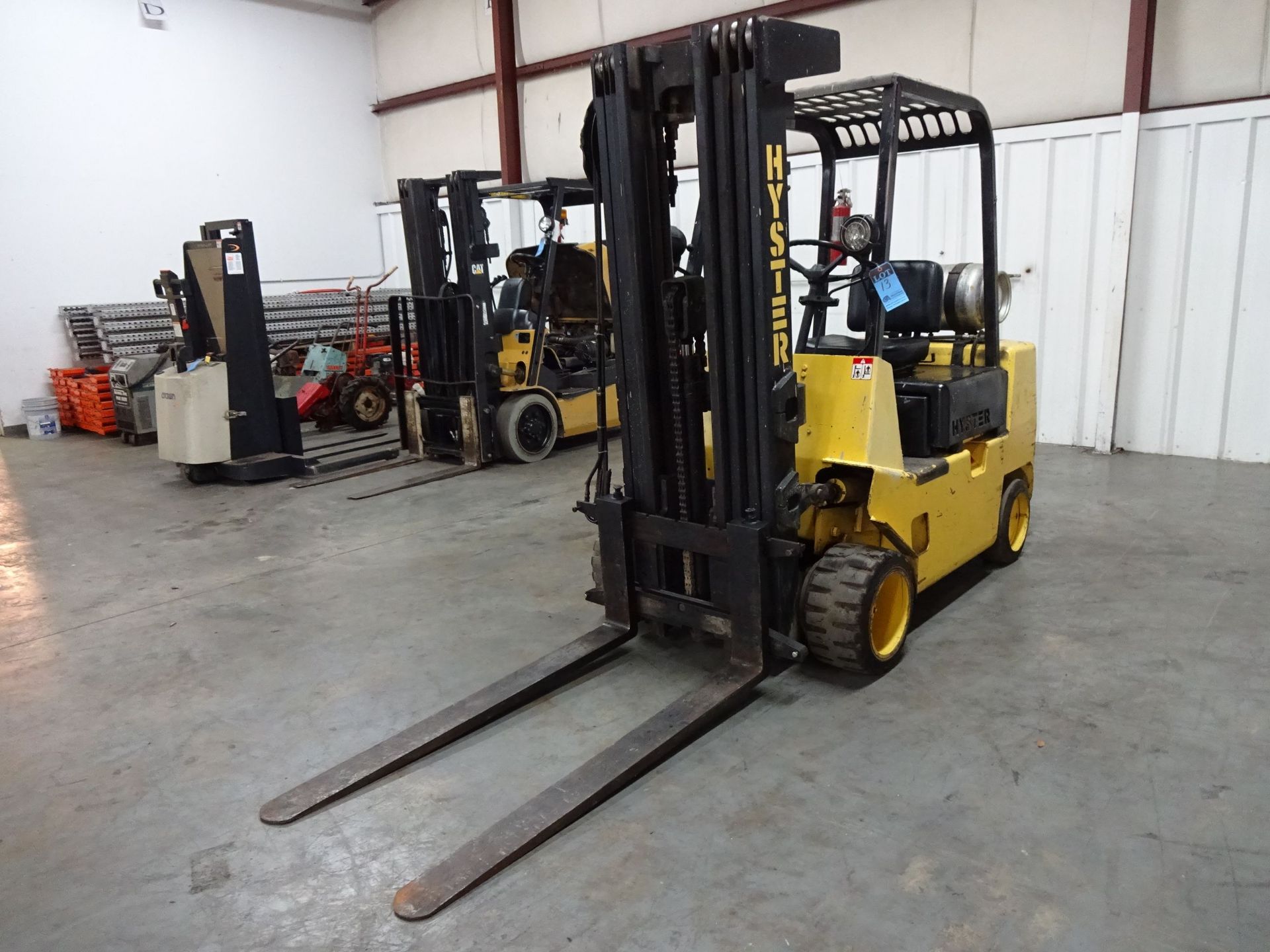 6,000 LB. HYSTER MODEL S60XL SOLID TIRE LP GAS LIFT TRUCK; S/N A187V15701K (1,179 HOURS), 4-STAGE