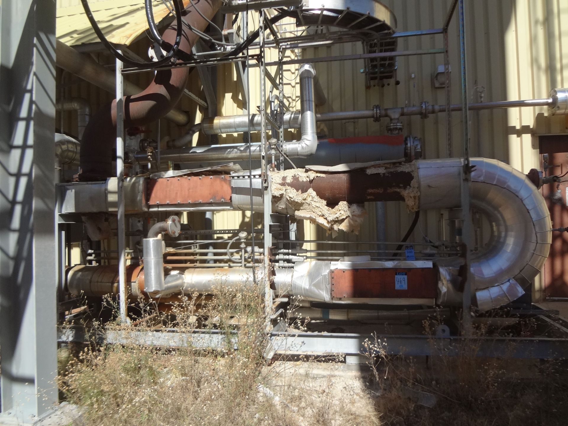 (LOT) PIPE AND VALVE SYSTEM NEXT TO BUILDING - DISCONNECT AT RED PAINT MARKING - DO NOT CHASE PIPE