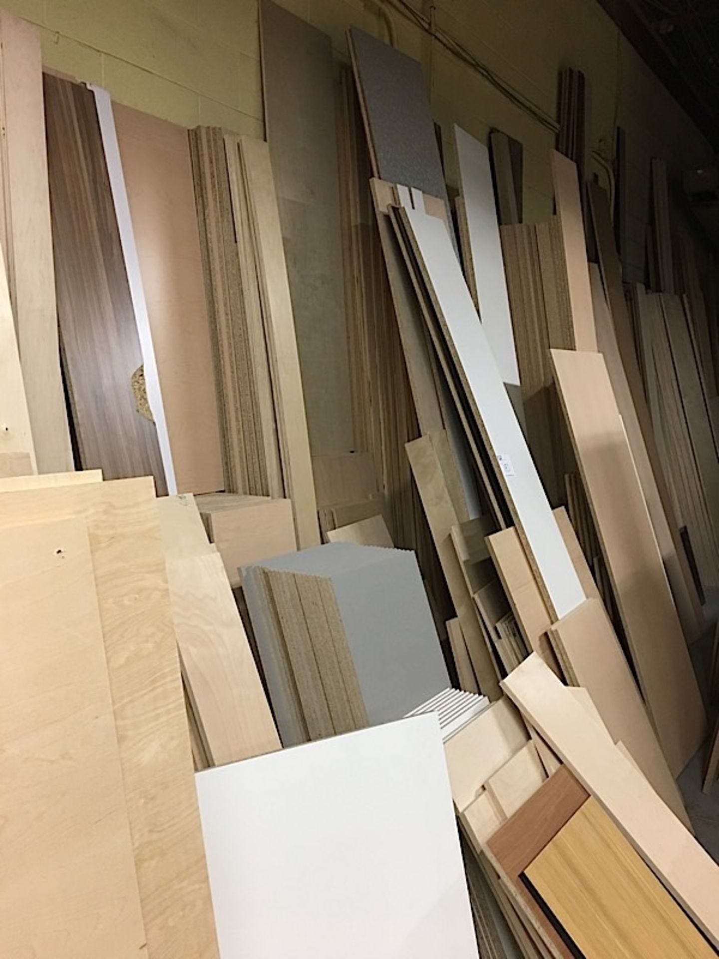 LOT OF CUT BOARDS (LEANING ON WALL)