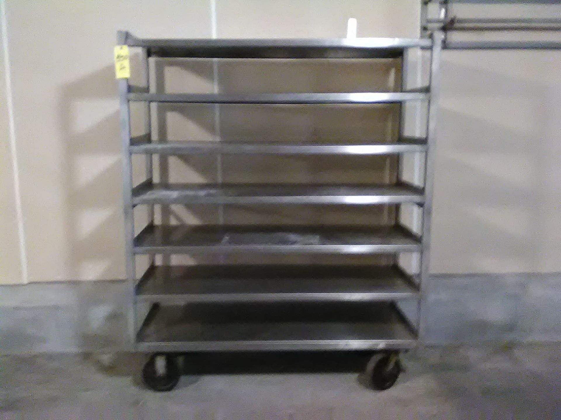 STAINLESS STEEL CART ON CASTERS. 7 SHELVES.