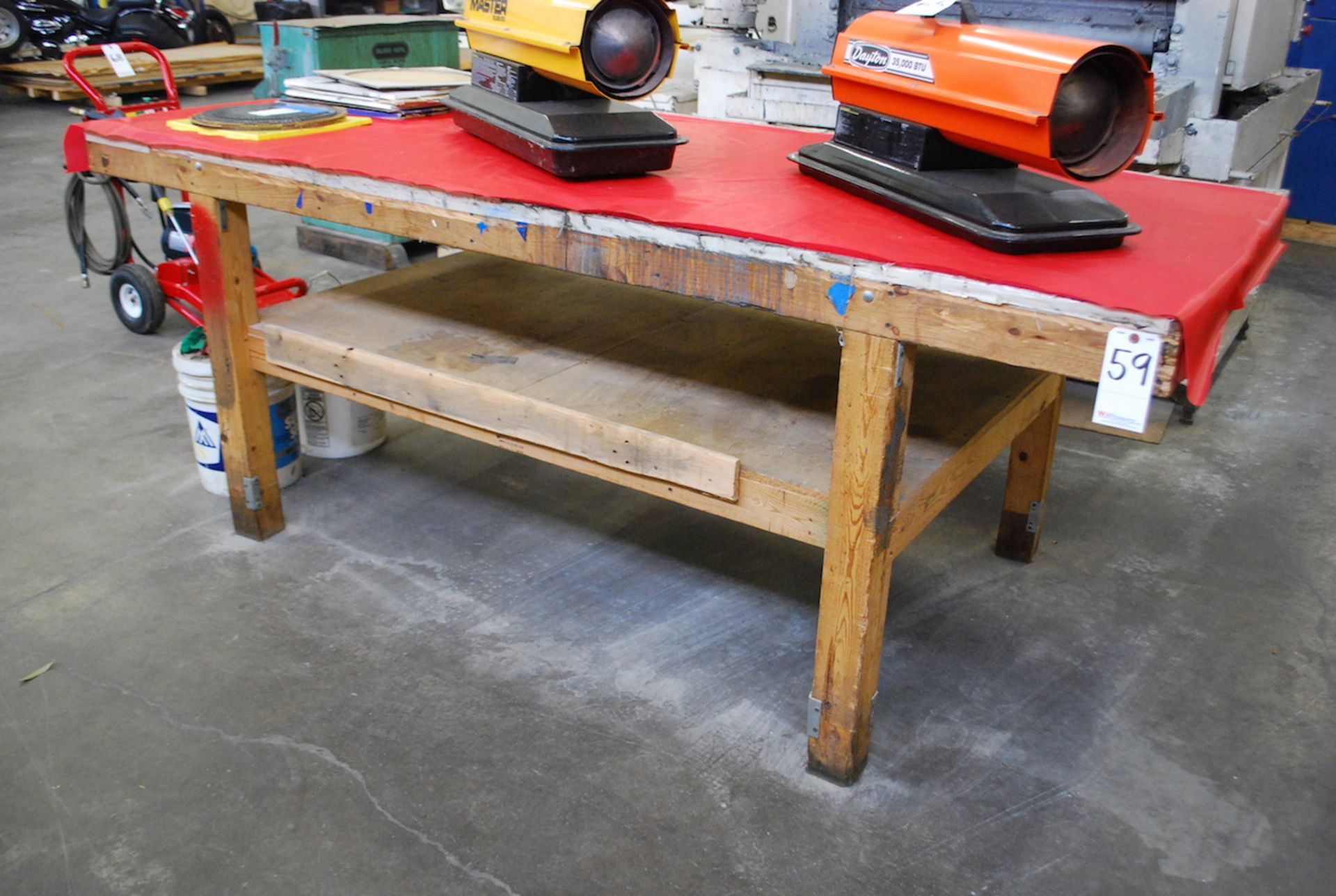 HEAVY DUTY WOOD WORK BENCH: 36” X 96” (NO CONTENTS)