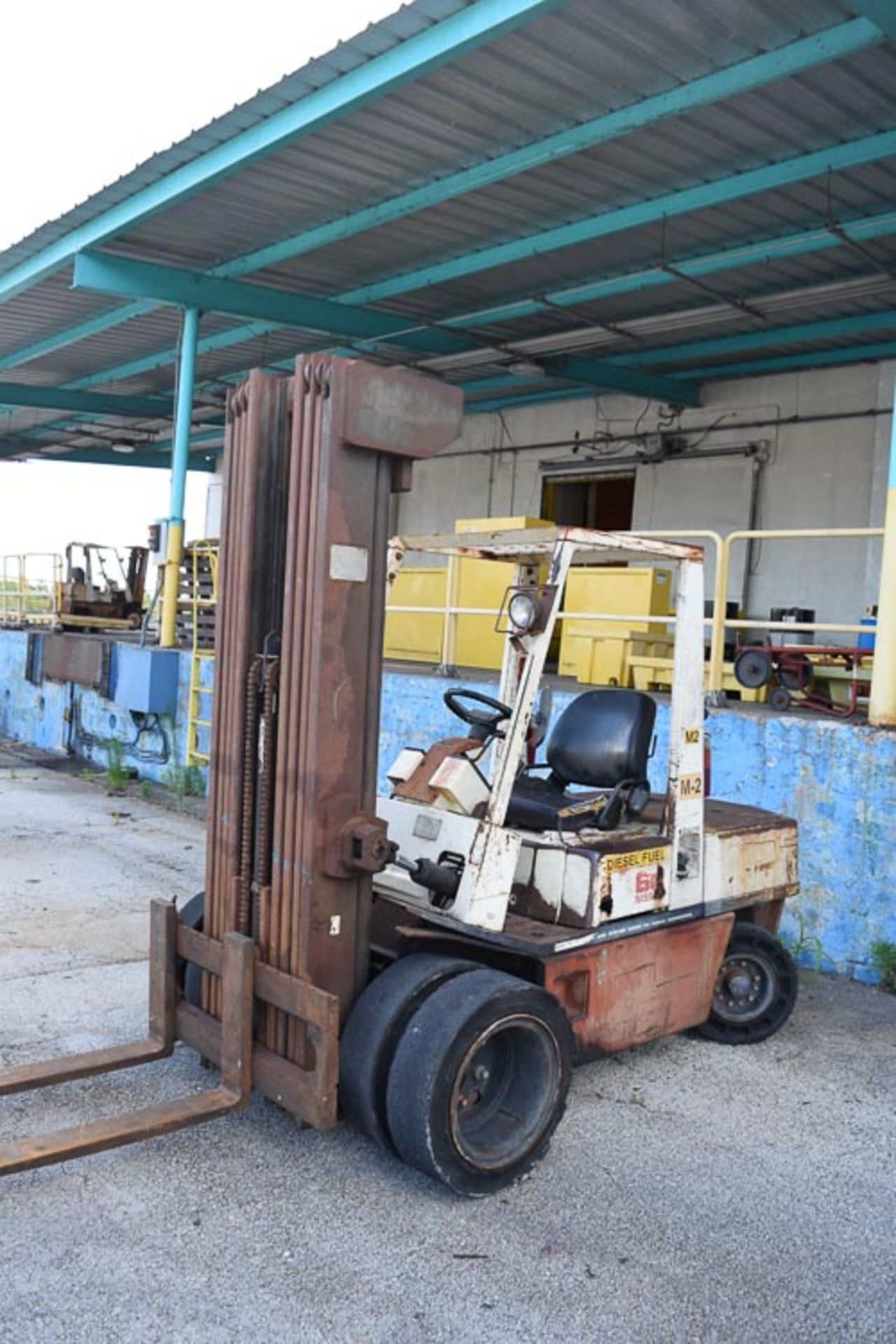 Nissan 6,000 Lb. Capacity Diesel Powered Sit Down Fork Lift, Model: EGH02A30V, SN: EGH02-92003,