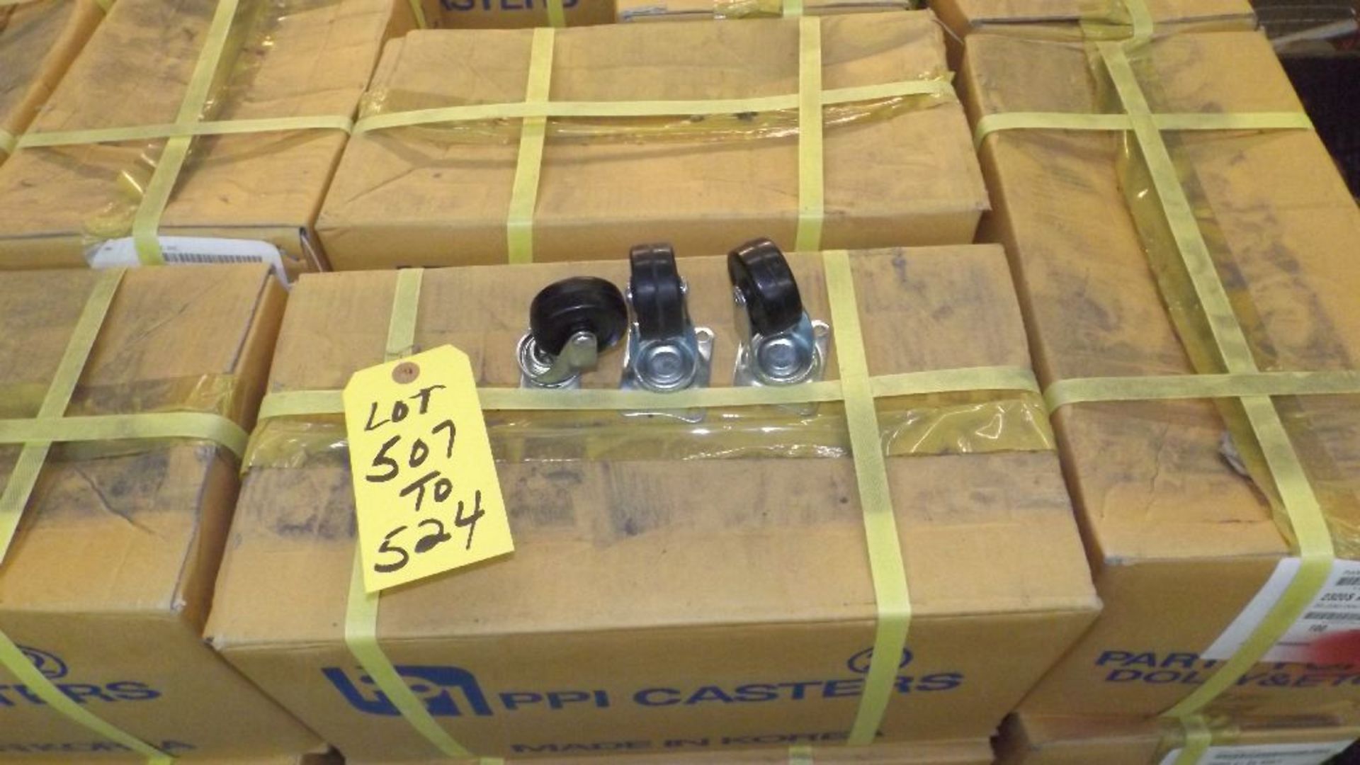 TWO HUNDRED 1 3/4" X 5/8" SWIVEL CASTERS IN TWO CASES