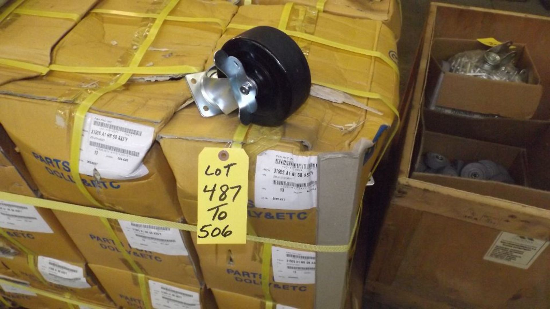 TWENTY-SIX 5" X 2" SWIVEL LOCKING CASTERS IN TWO CASES