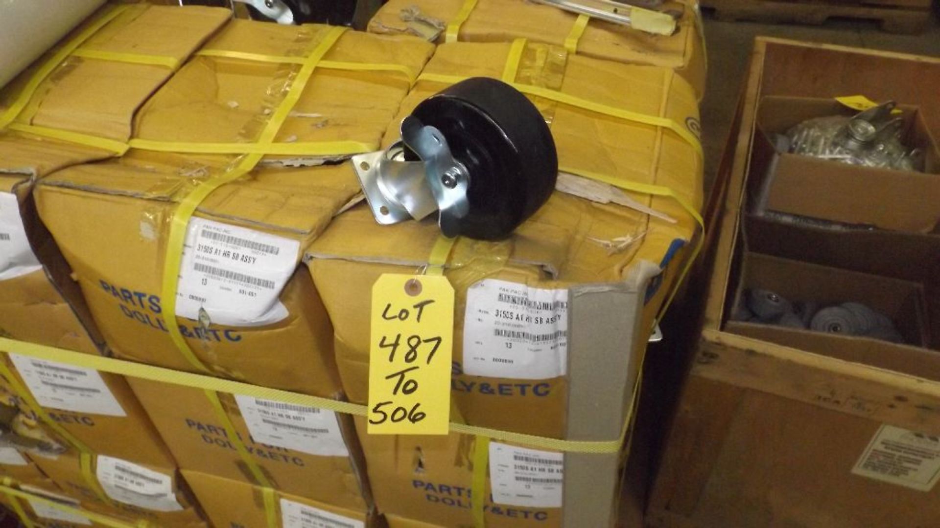 TWENTY-SIX 5" X 2" SWIVEL LOCKING CASTERS IN TWO CASES