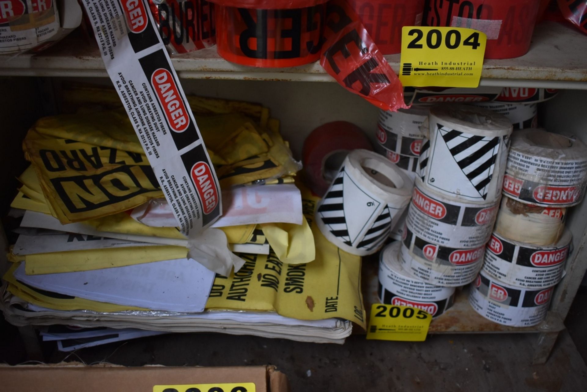 ASSORTED CAUTION TAPE ON ONE SHELF