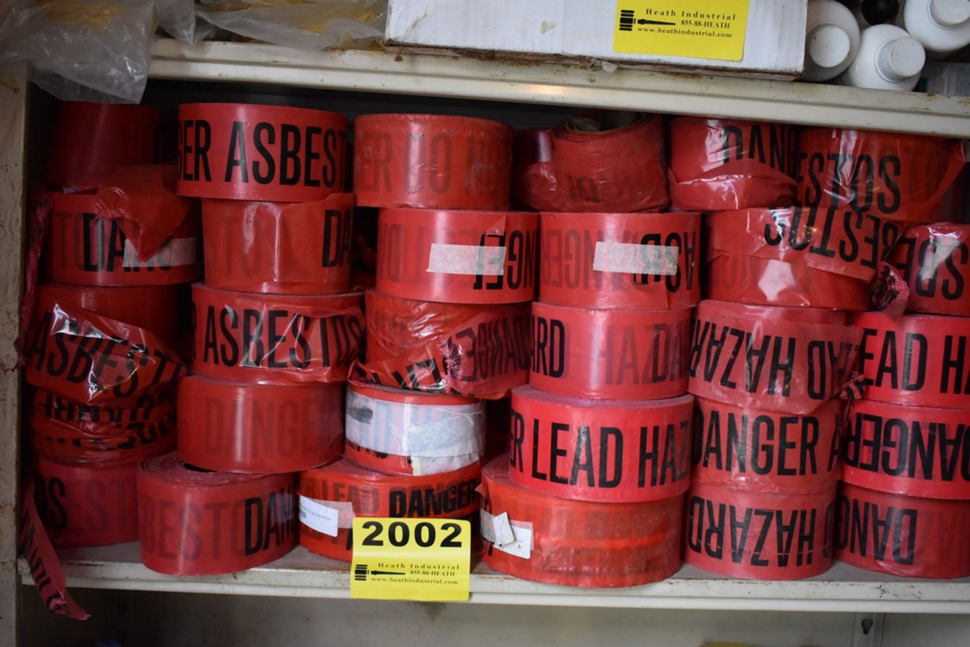 ASSORTED CAUTION TAPE ON ONE SHELF