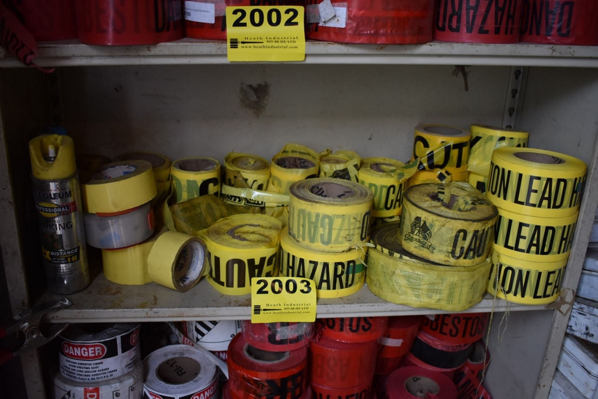 ASSORTED CAUTION TAPE ON ONE SHELF