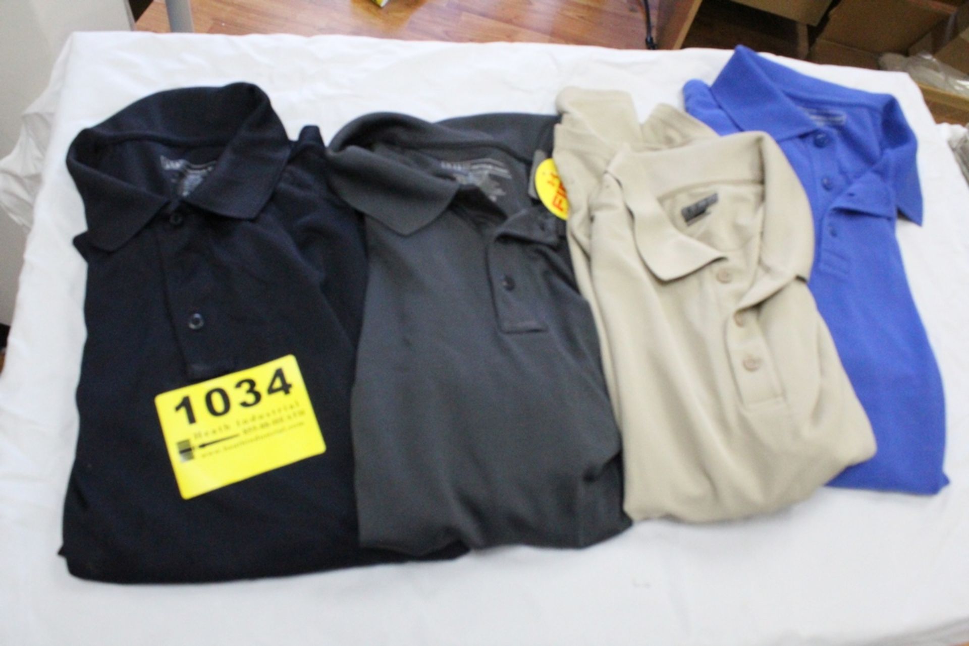 (4) POLO SHIRTS IN ASSORTED SIZES
