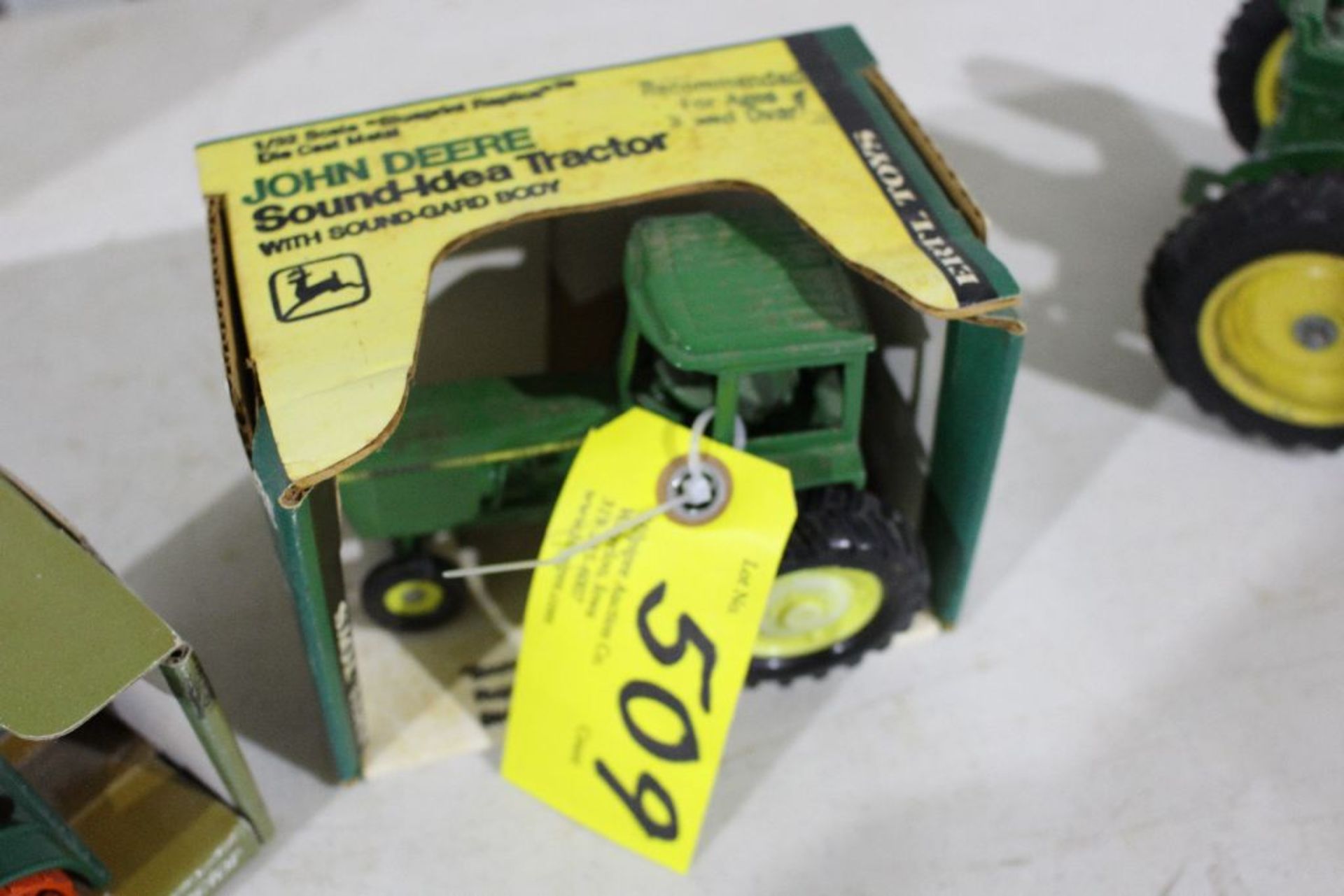 John Deere tractor, in yellow box, 1/32 scale model.