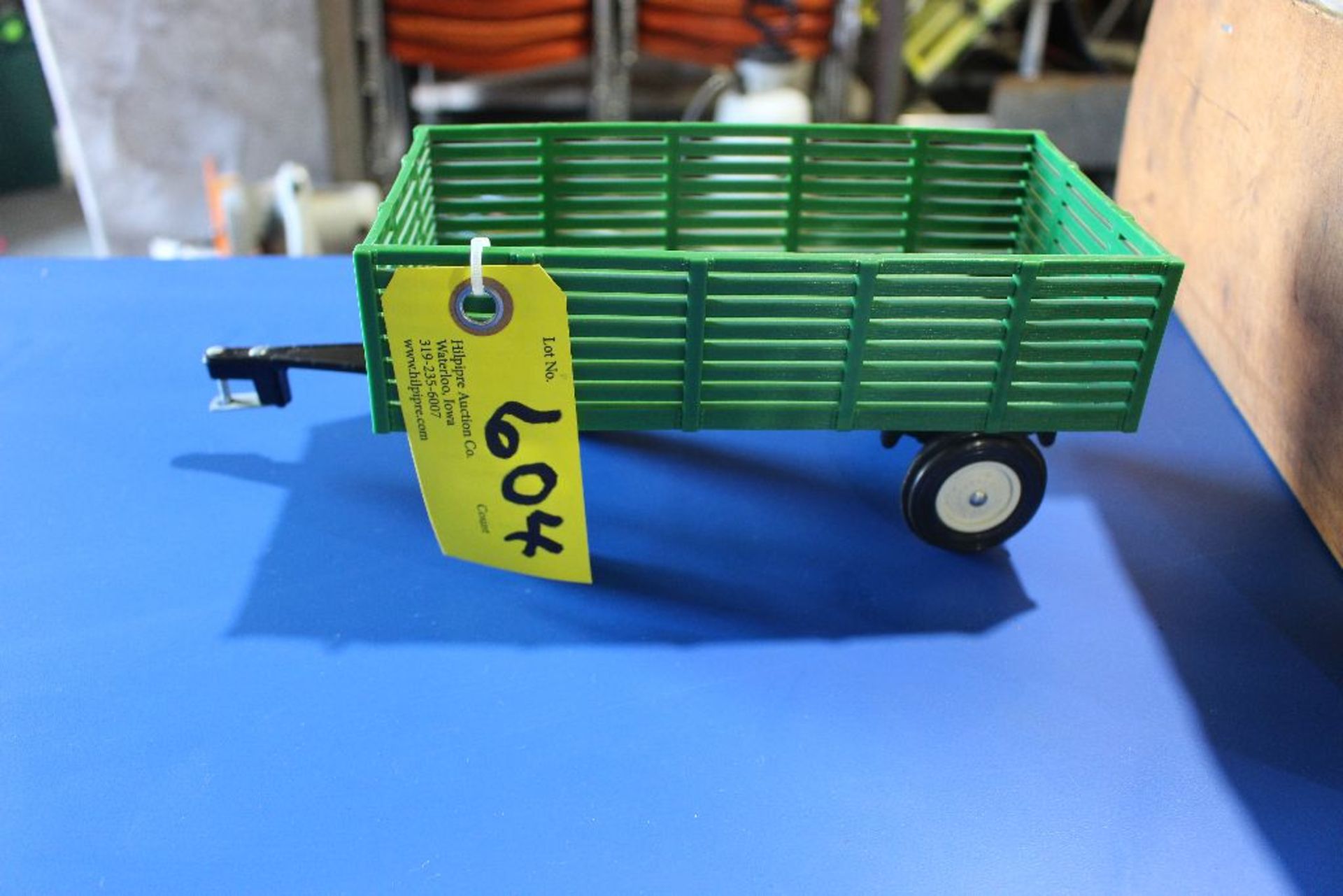 Plastic John Deere wagon, metal running gear.