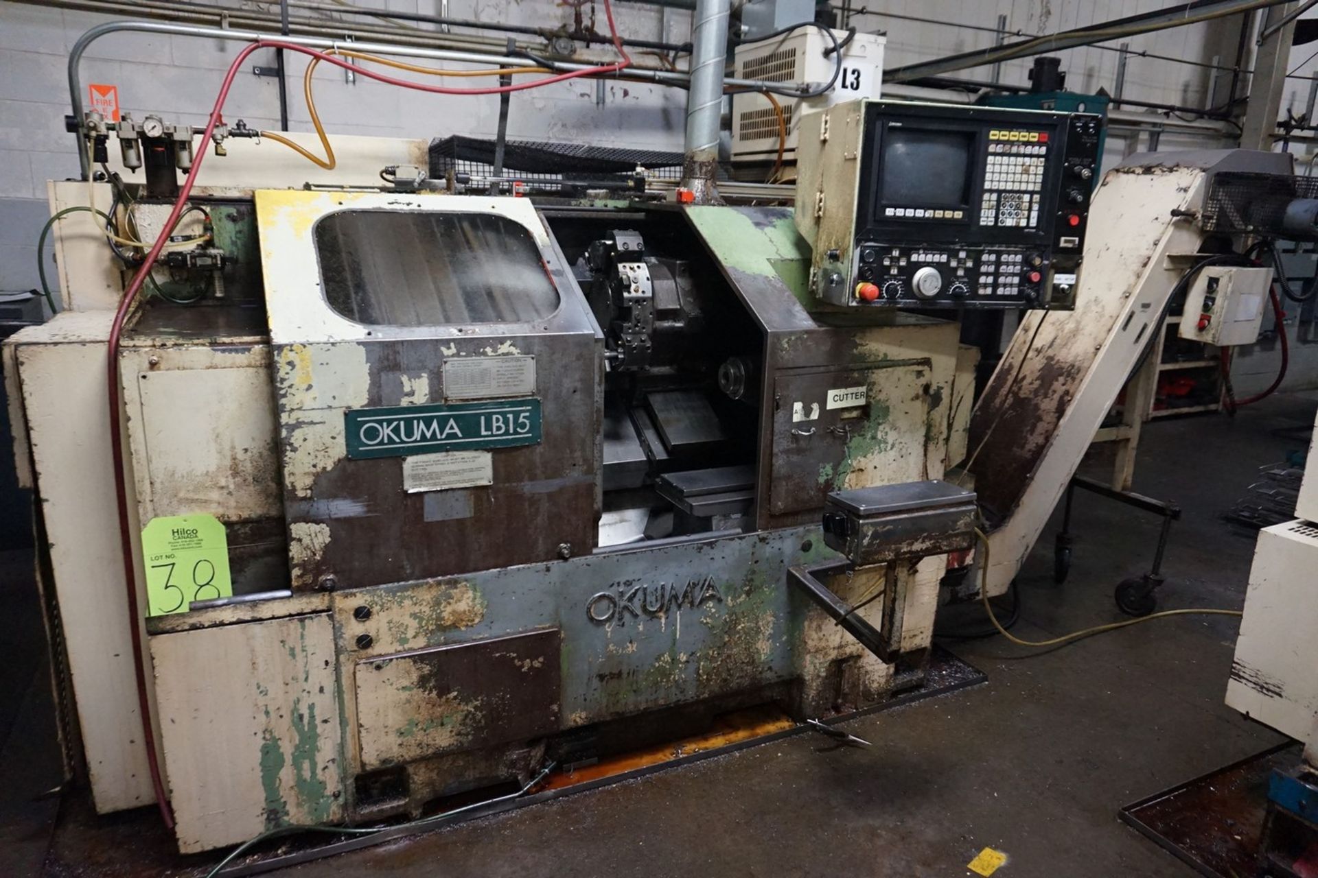 Okuma Model LB15 CNC Lathe 220/440V with Enomoto Chip Conveyor, Transformer