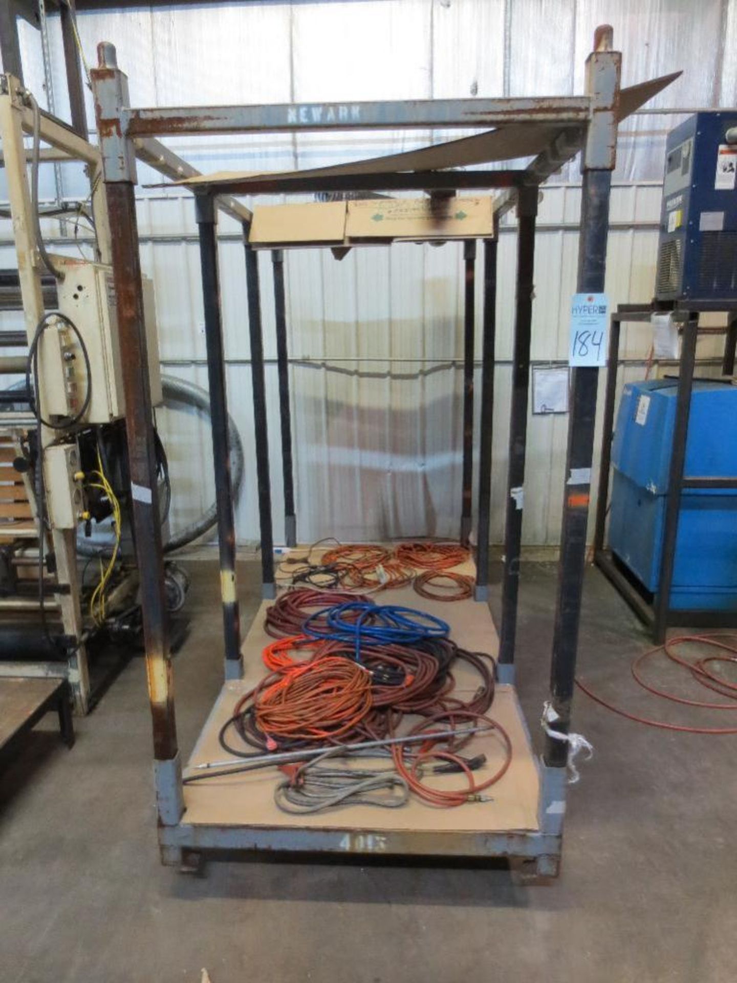 Steel rolling rack with extension cords and air hoses