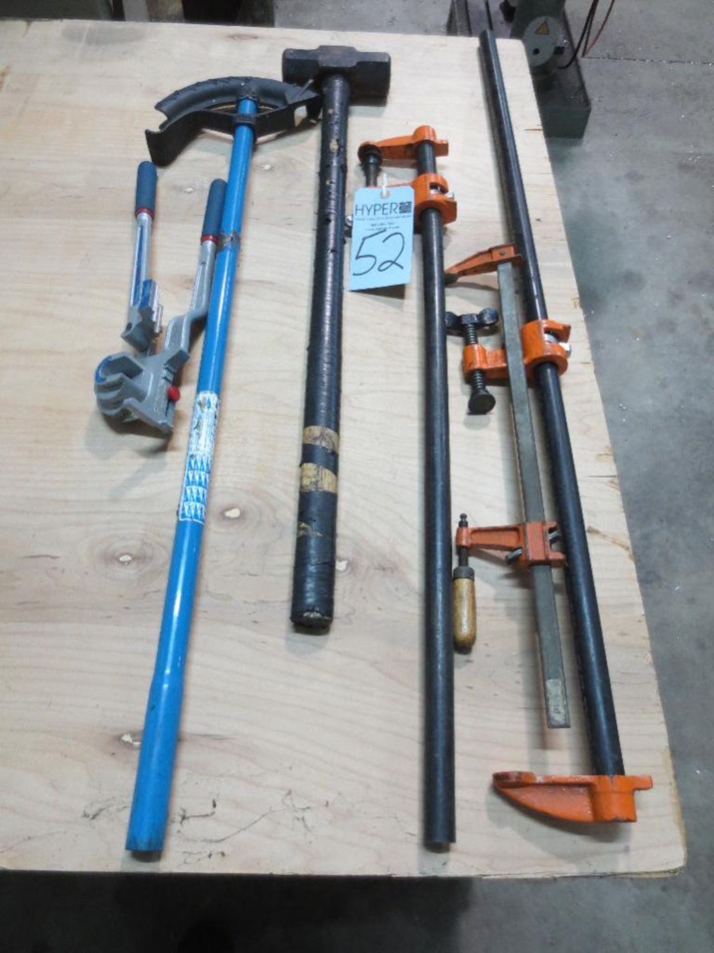 Two pipe benders, sledge hammer, three clamps