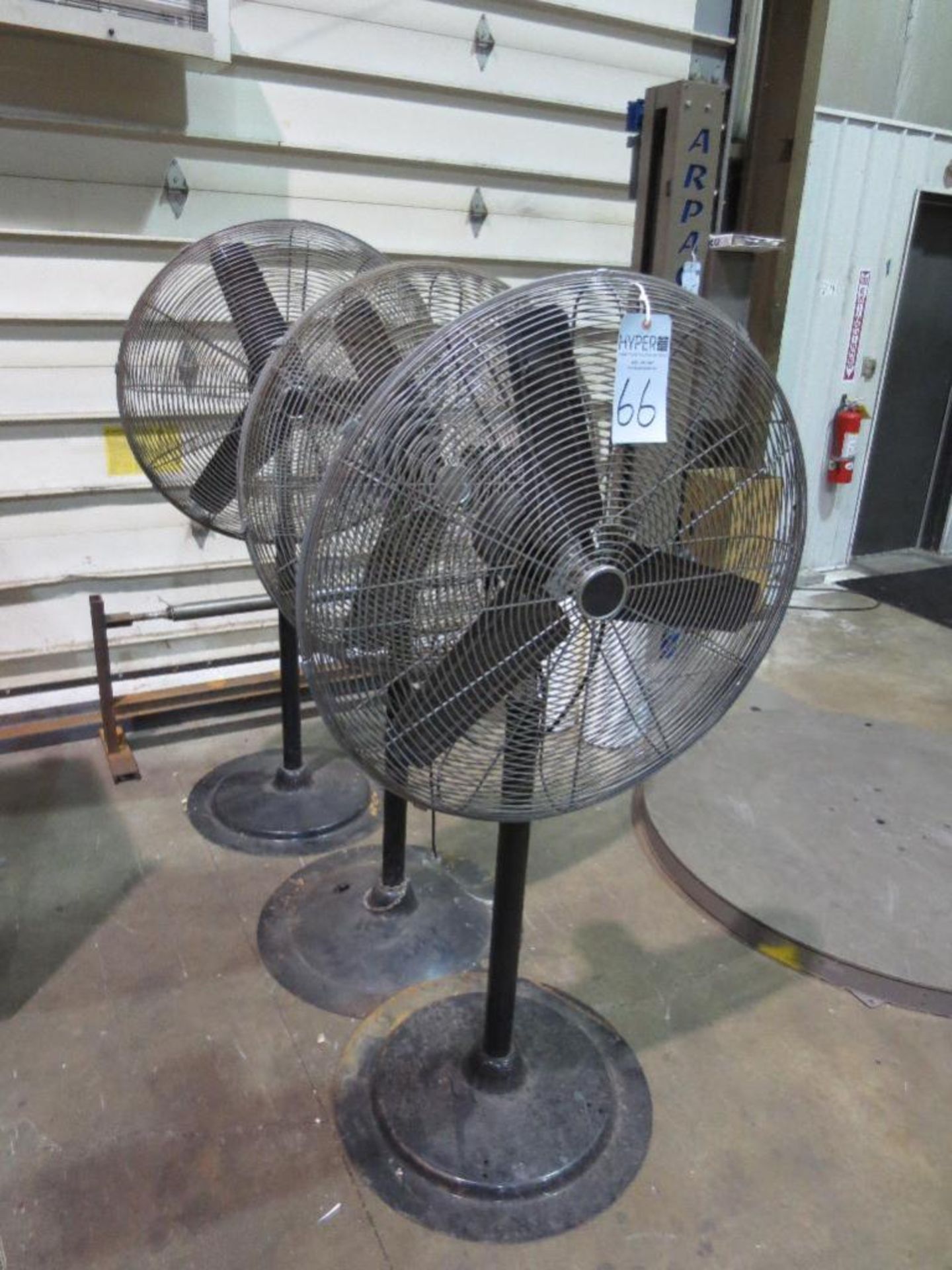 Three pedestal shop fans