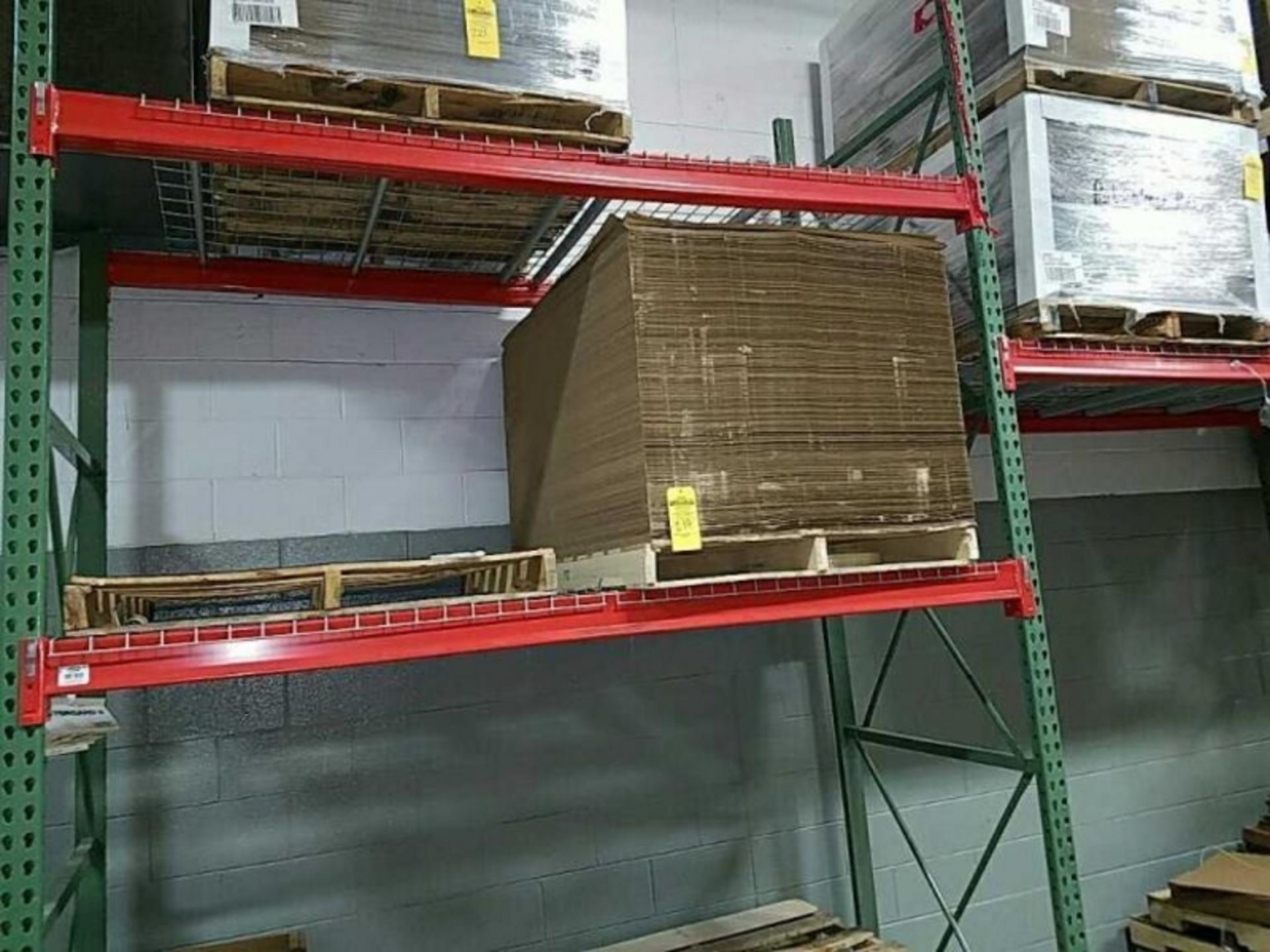 Partial pallet of slip sheets and two pallets