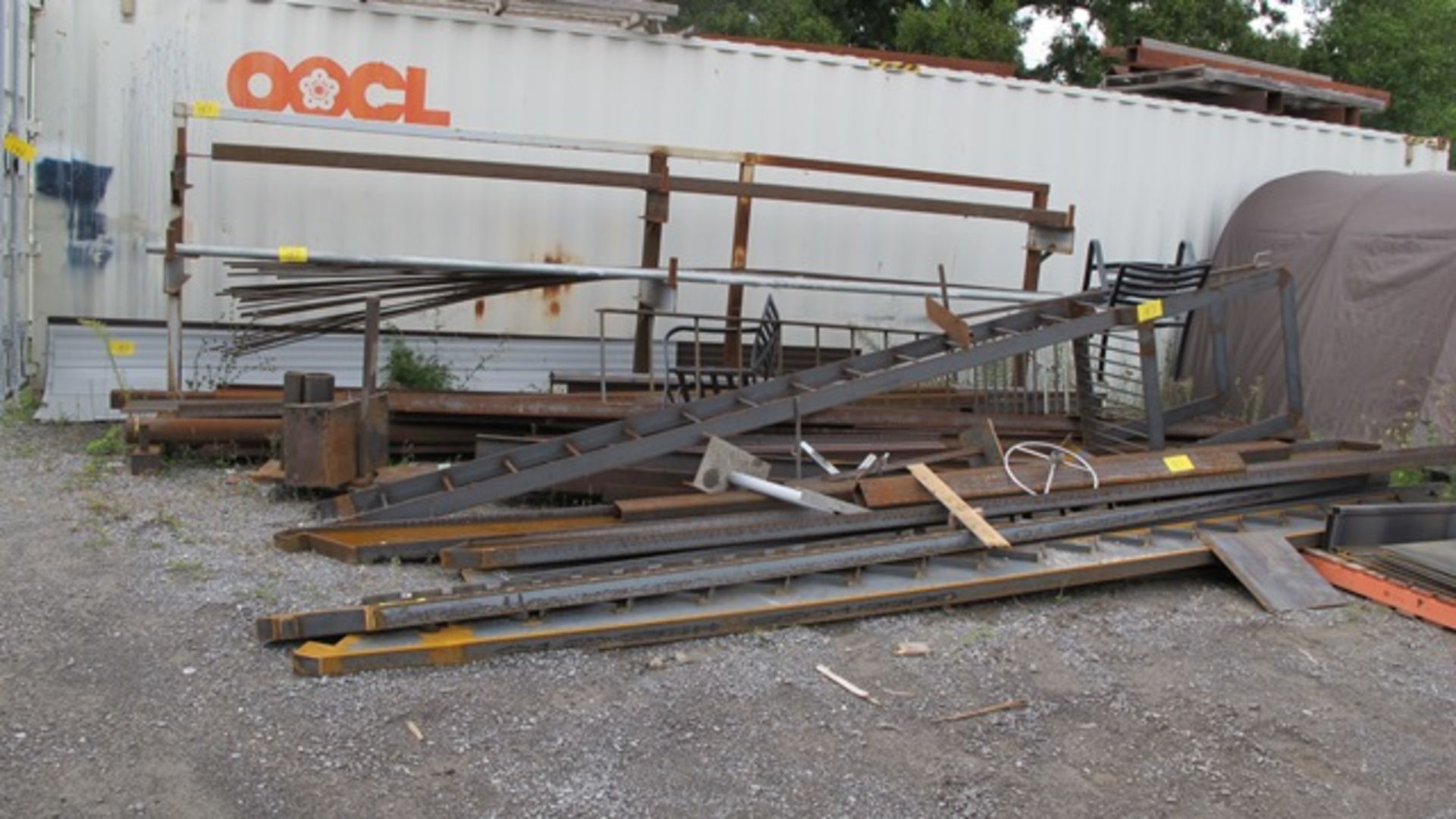 LOT ASST. STEEL LADDERS, RAILS, TUBE ETC. W/STEEL ON ROOF OF CONTAINER (IN YARD)