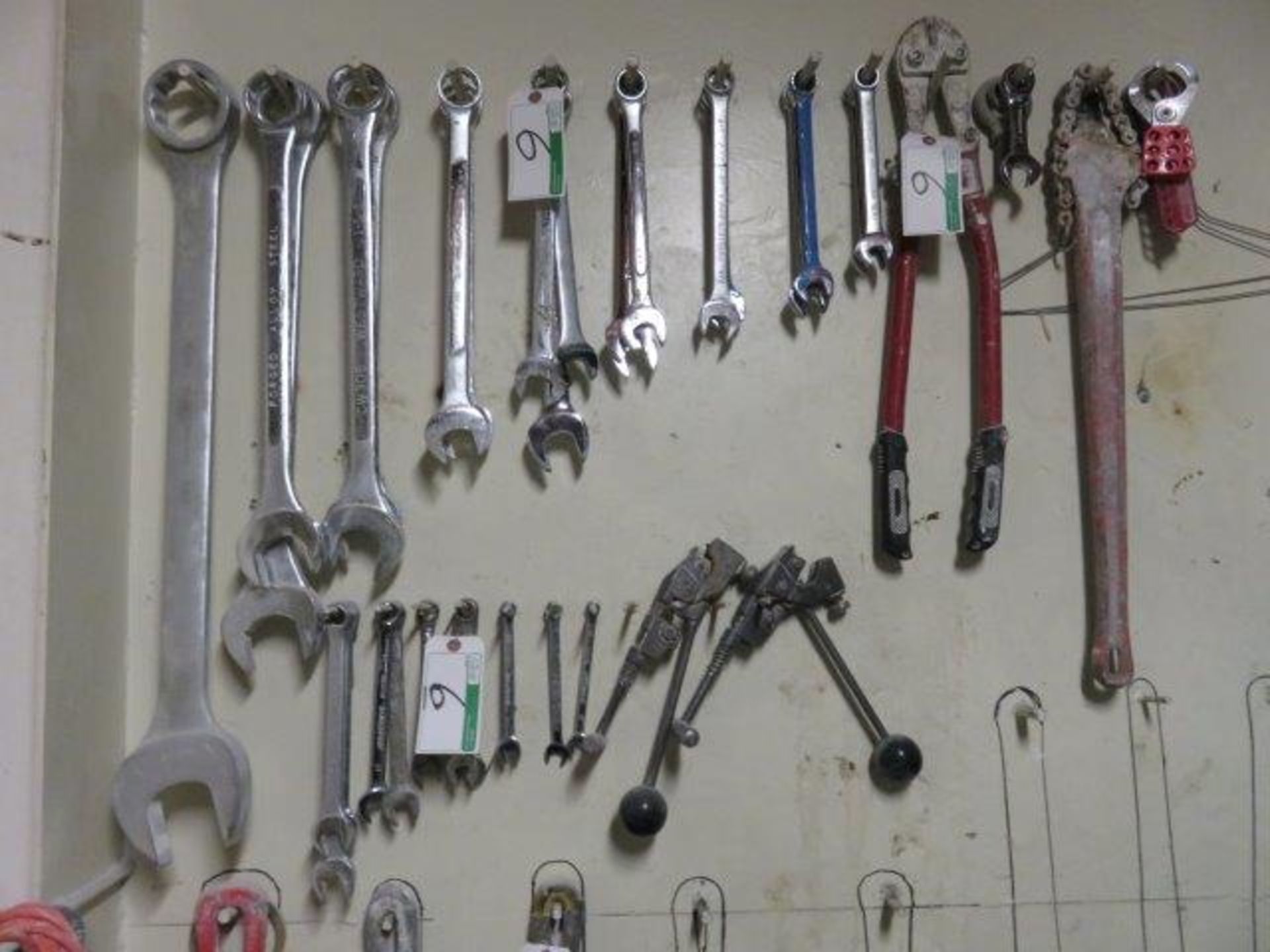 LARGE LOT OF COMBO WRENCHES ETC. ON WALL