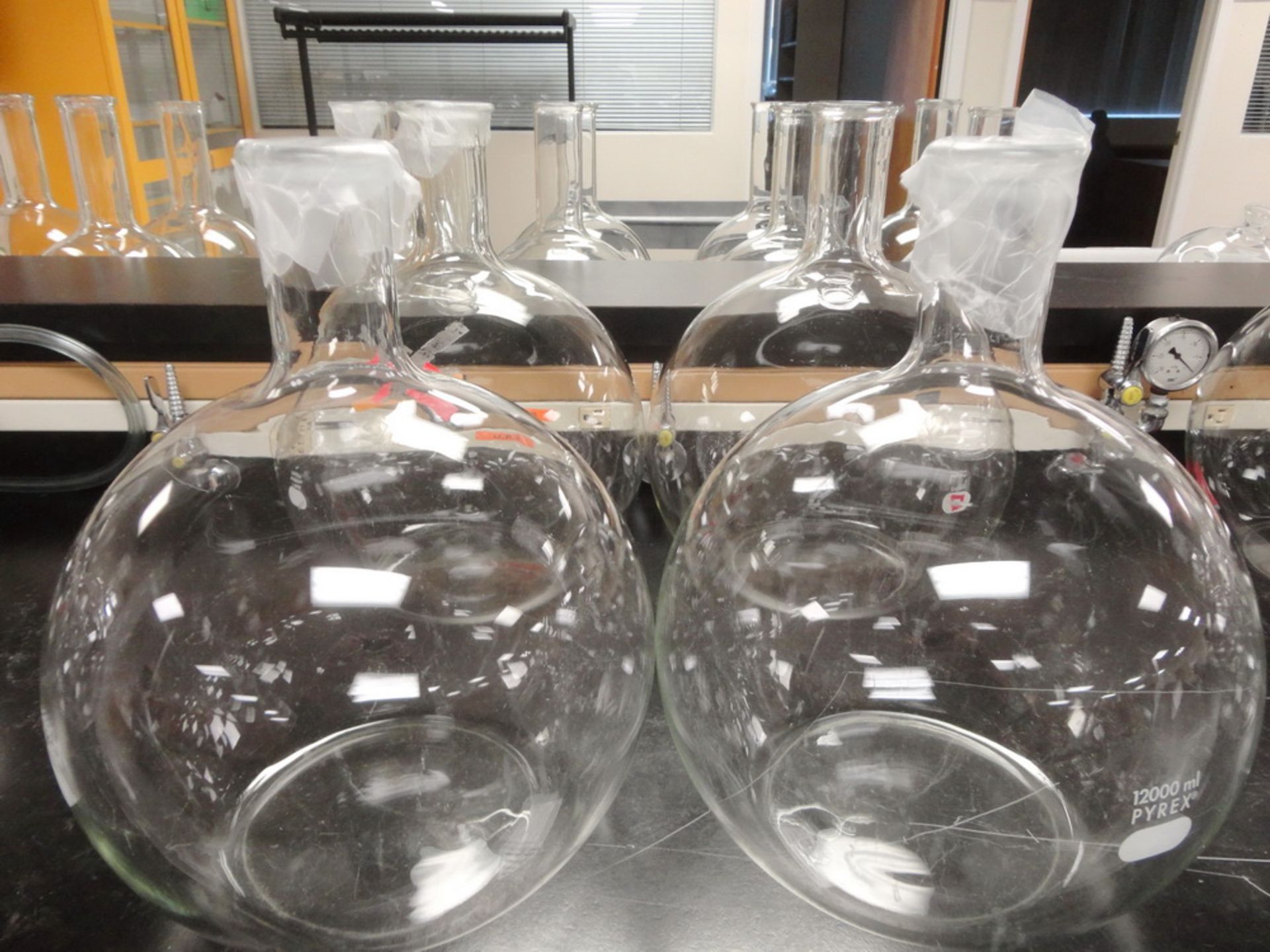 (4) Pyrex 12,000 ml flat bottom, round body flasks