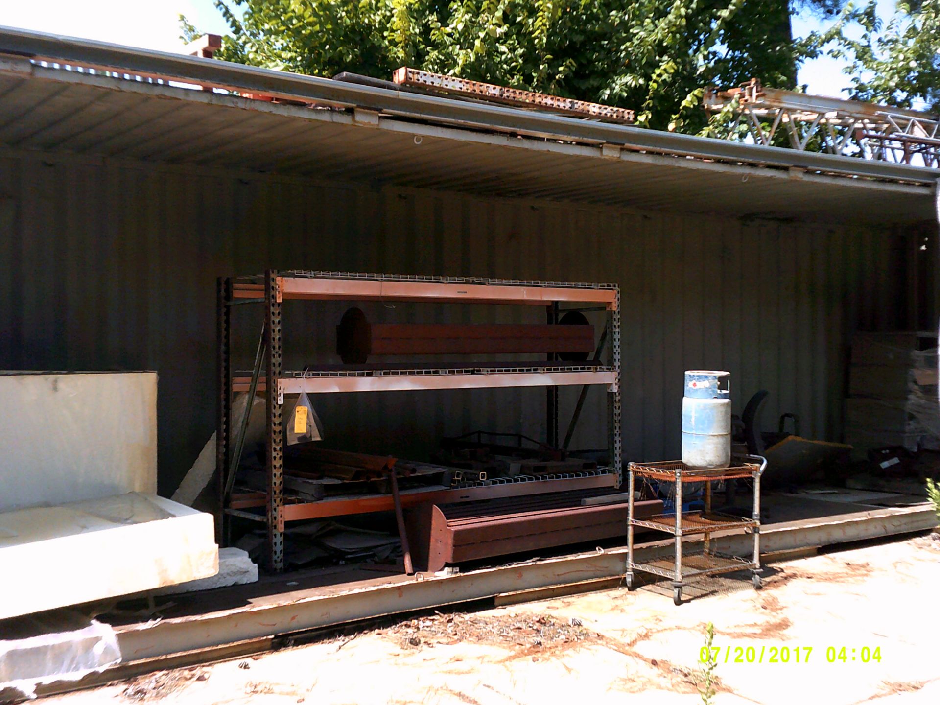 (3) storage containers, 6'x9'x3' pallet rack, (5) wire rolling carts, propane cage, etc.