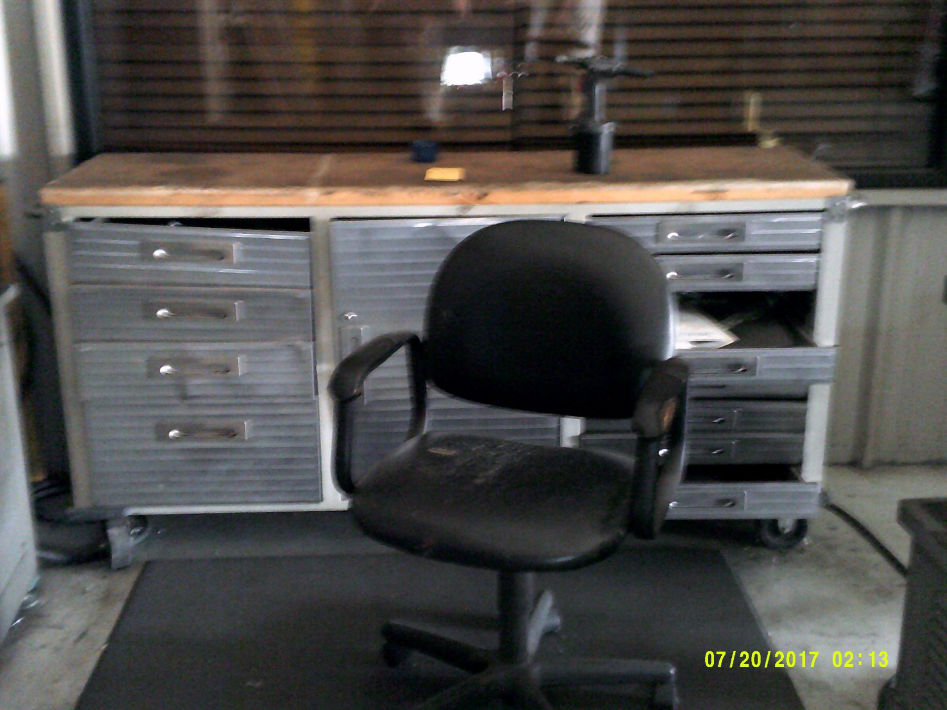 Tool cabinet w/ 1 drawer & 1 door, small worktable, misc office content, office chair, stress mat