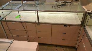 70" x 24” x 40” Mirrored Front Single Level Display Cabinet, Lighting and (9) Pull out Drawers on