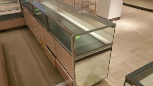 70" x 24” x 40” Mirrored Front Single Level Display Cabinet, Lighting and (9) Pull out Drawers on