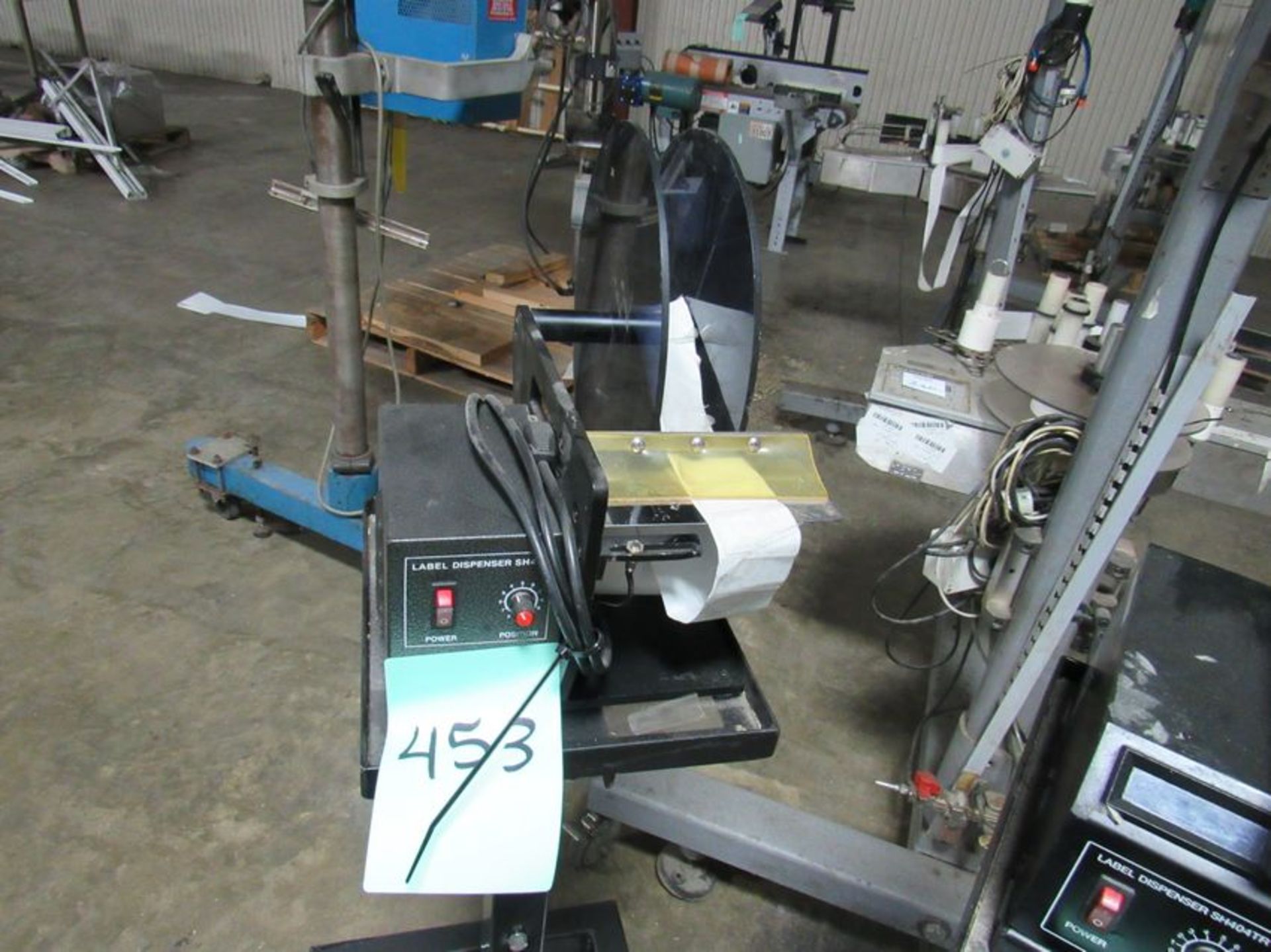 Label Dispenser comes with manual and on stand with casters (Rigging and loading fees included in