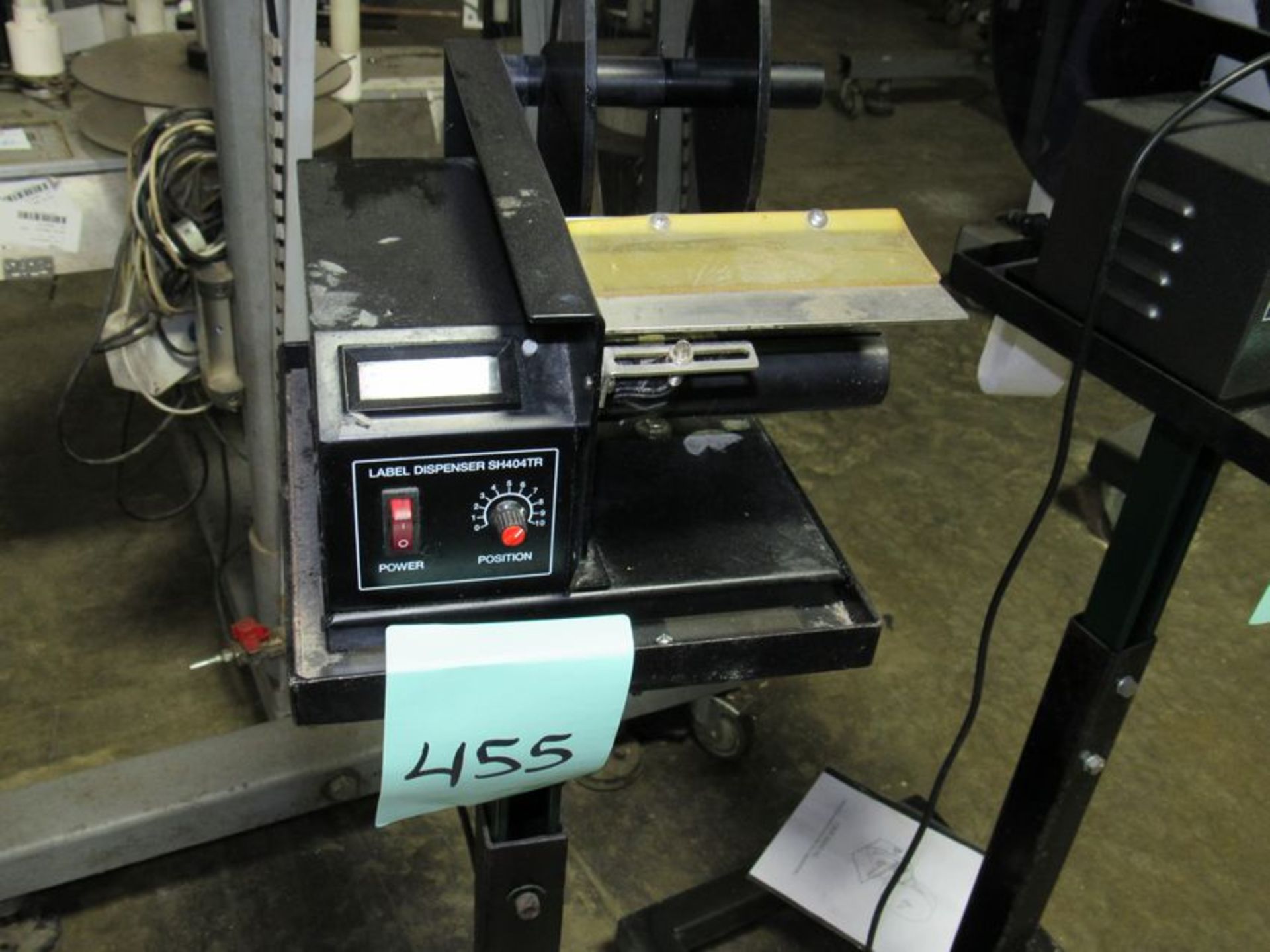 Label Dispenser comes with manual and on stand with casters (Rigging and loading fees included in