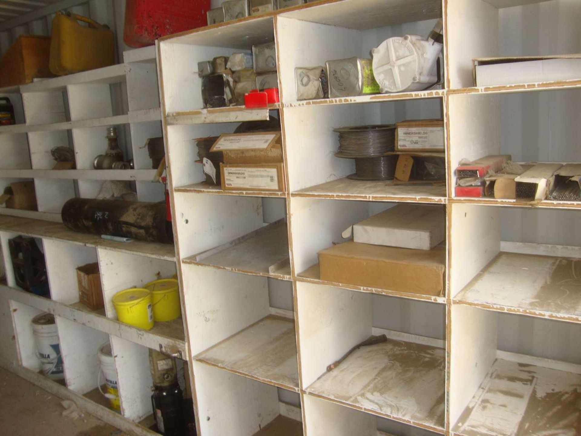 Lot of welding supplies and parts on wall
